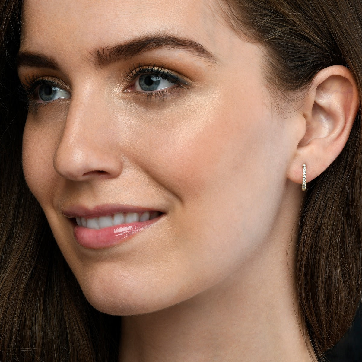 Diamond huggie hoop earrings in 9K yellow gold