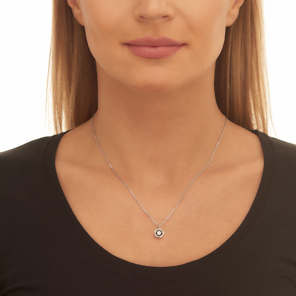 Flower solitaire 0.20ct round diamond pendant in 18K white gold