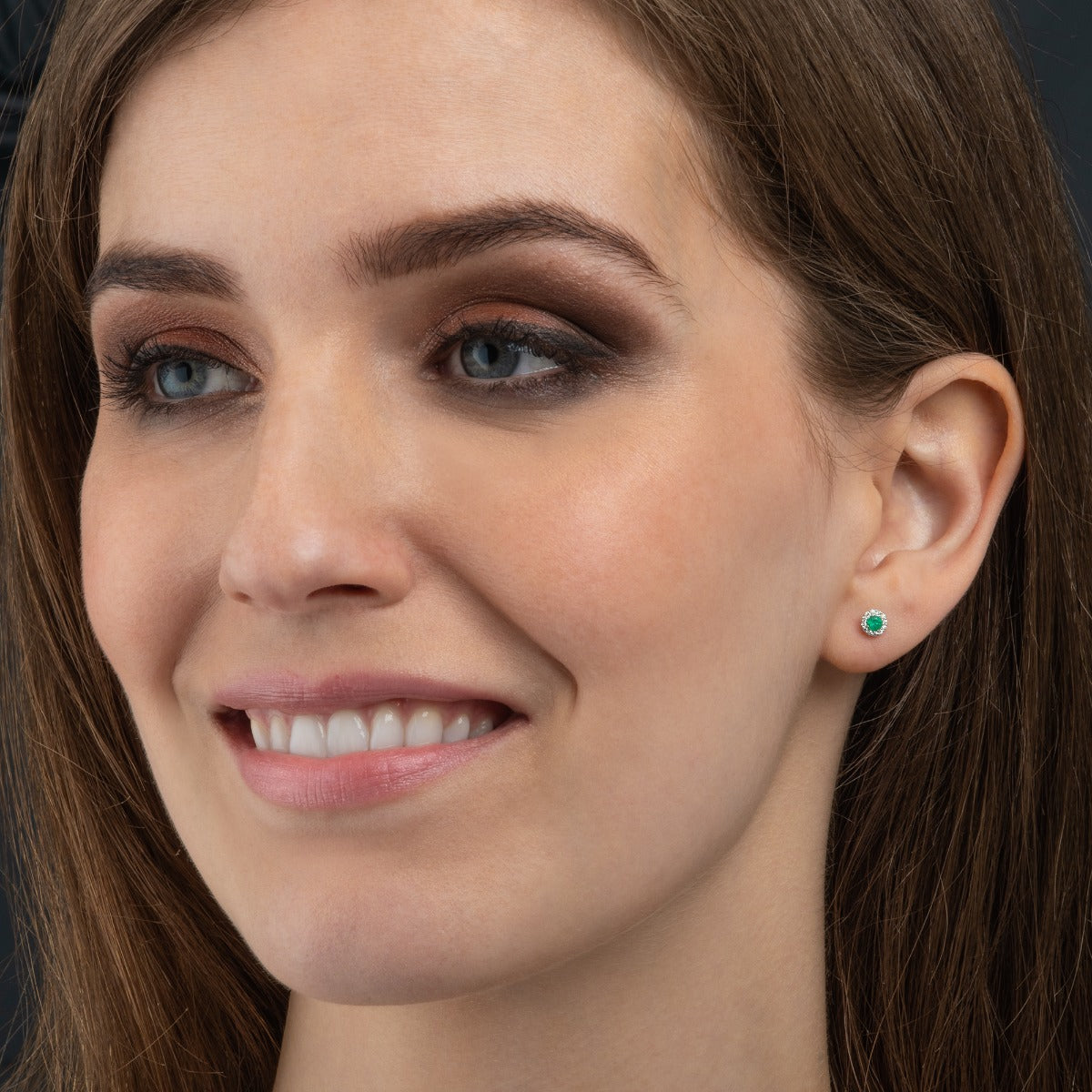 Dainty emerald stud earrings in 9K White gold