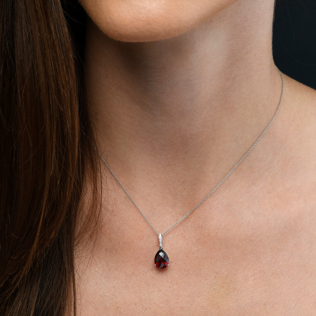 8mm x 12mm Garnet with 0.05ct Diamond pendant in 9K white gold