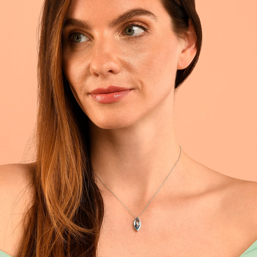 7mm x 14mm Blue Topaz with 0.16ct Diamond pendant in 9K white gold