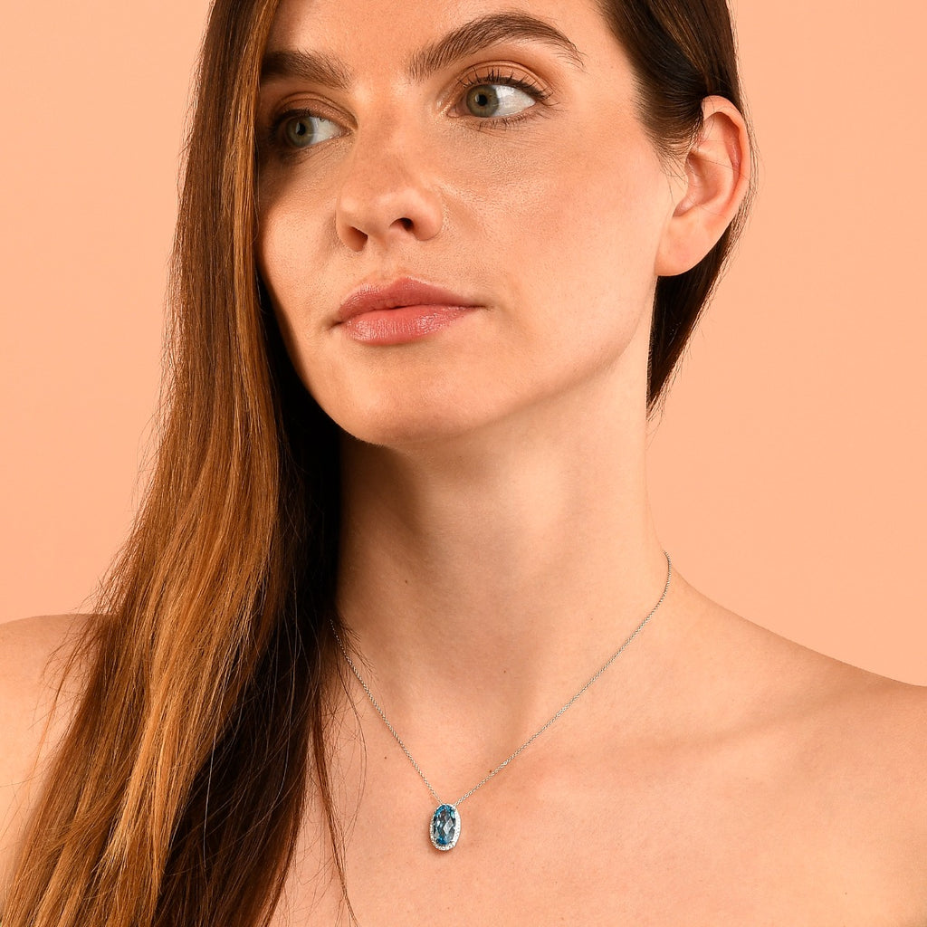 8mm x 14mm Blue Topaz with 0.16ct Diamond pendant in 9K white gold