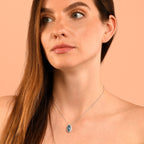 8mm x 14mm Blue Topaz with 0.16ct Diamond pendant in 9K white gold
