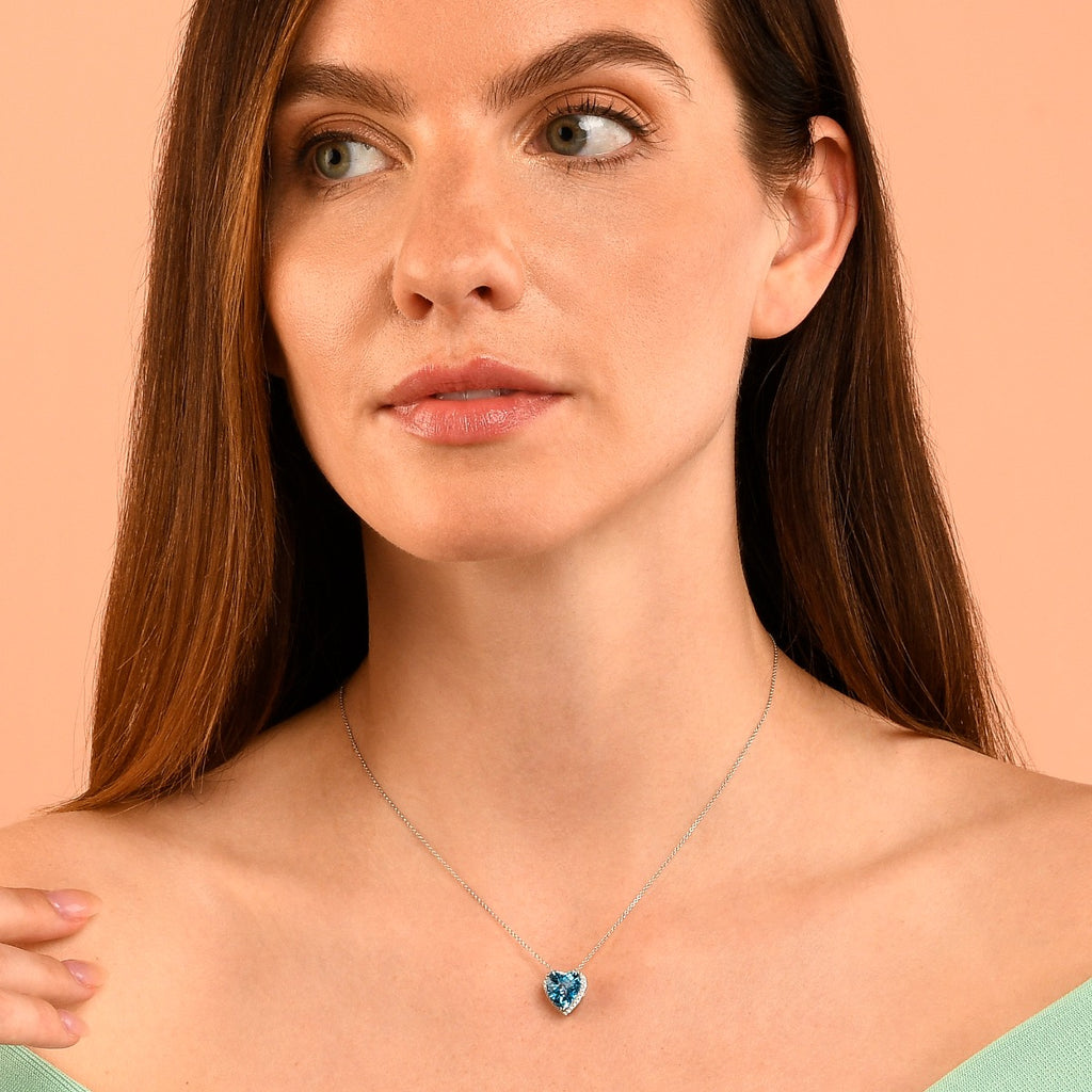 9mm x 10mm Blue Topaz with 0.15ct Diamond pendant in 9K white gold