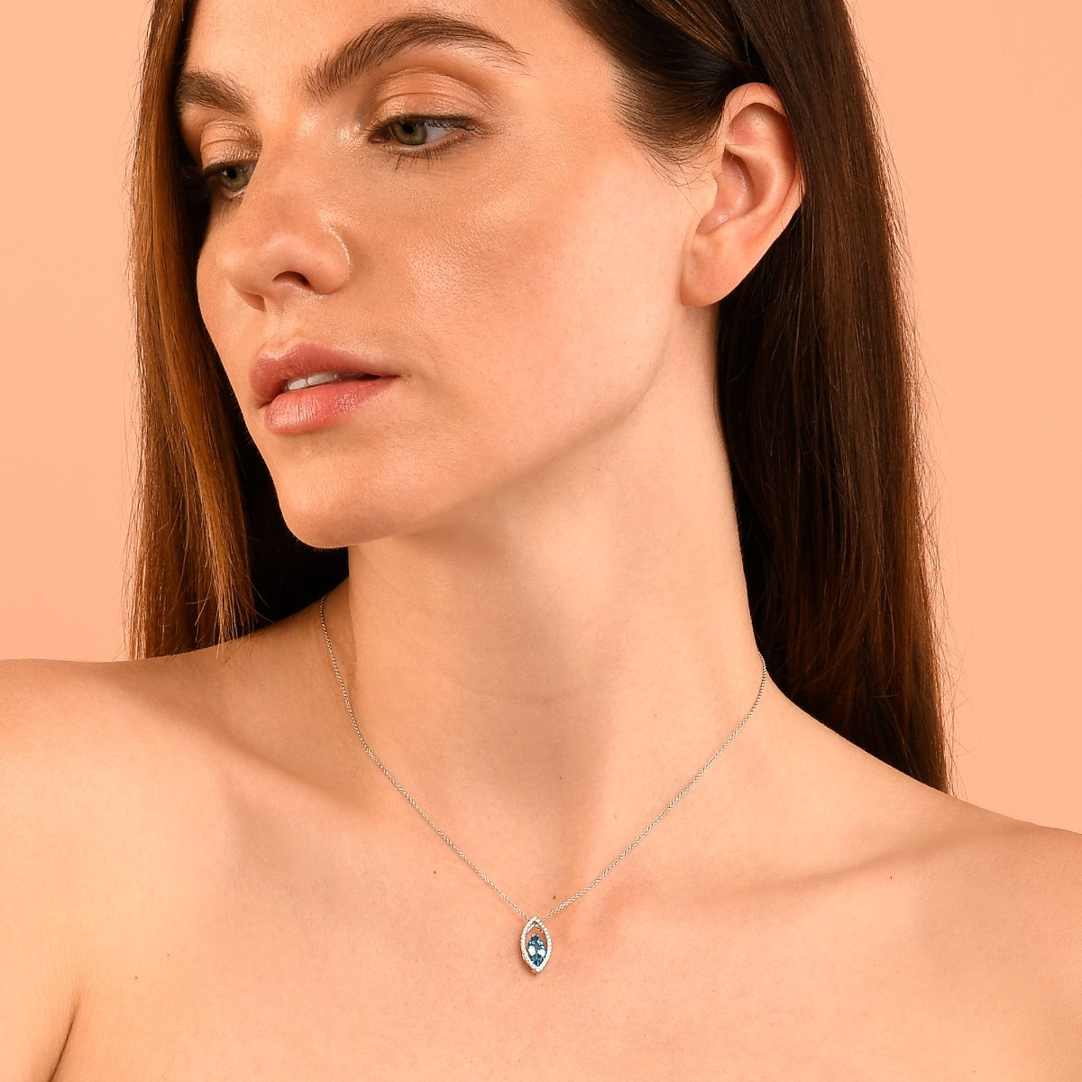 5mm x 10mm Blue Topaz with 0.16ct Diamond pendant in 9K white gold