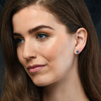 5mm x 7mm Small Blue Topaz and 0.07ct diamond stud earrings in 9K white gold 