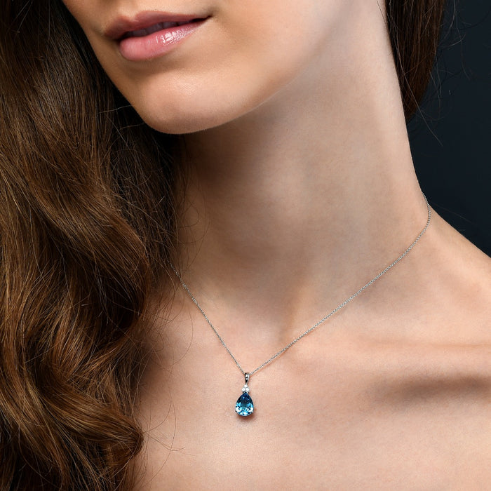 2.55ct Pear Blue Topaz With 0.05ct Diamond Pendant In 9K White Gold