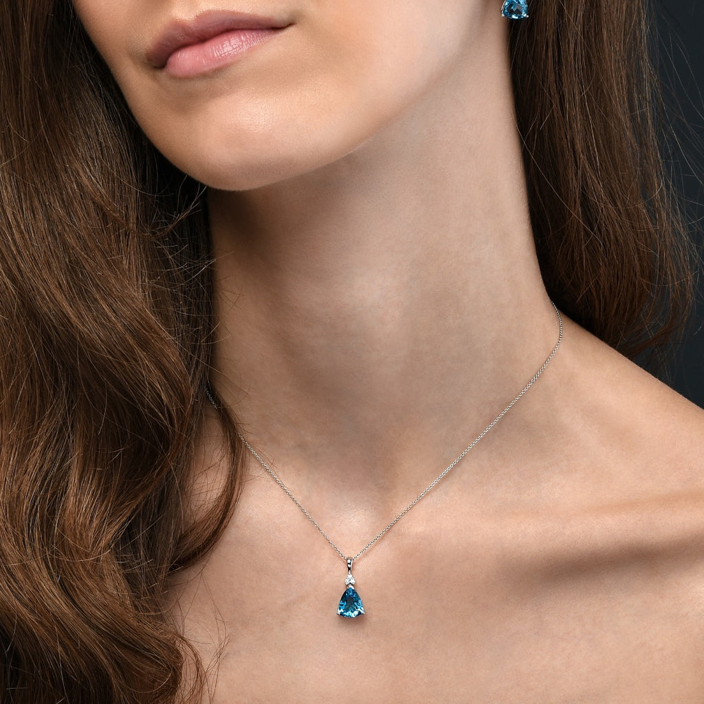 8mm x 10mm Blue Topaz with 0.05ct Diamond pendant necklace in 9K white gold