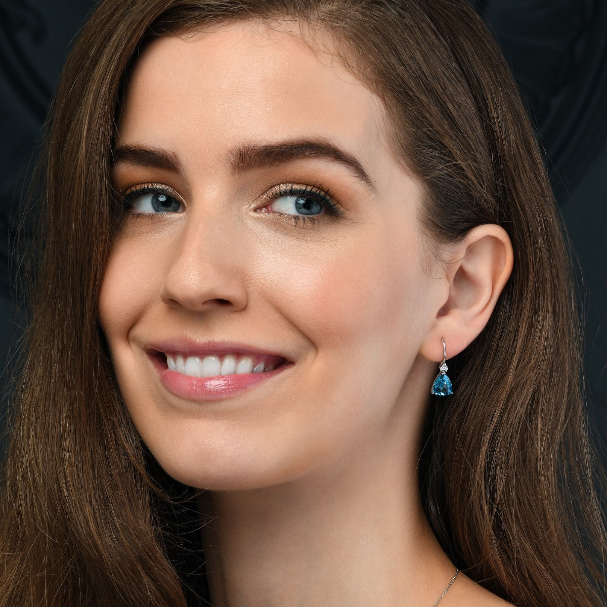 6.30ct Blue Topaz And 0.10ct Diamond Earrings In 9K White Gold