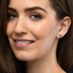 Round Emerald and 0.22ct diamond stud earrings in 9K yellow gold
