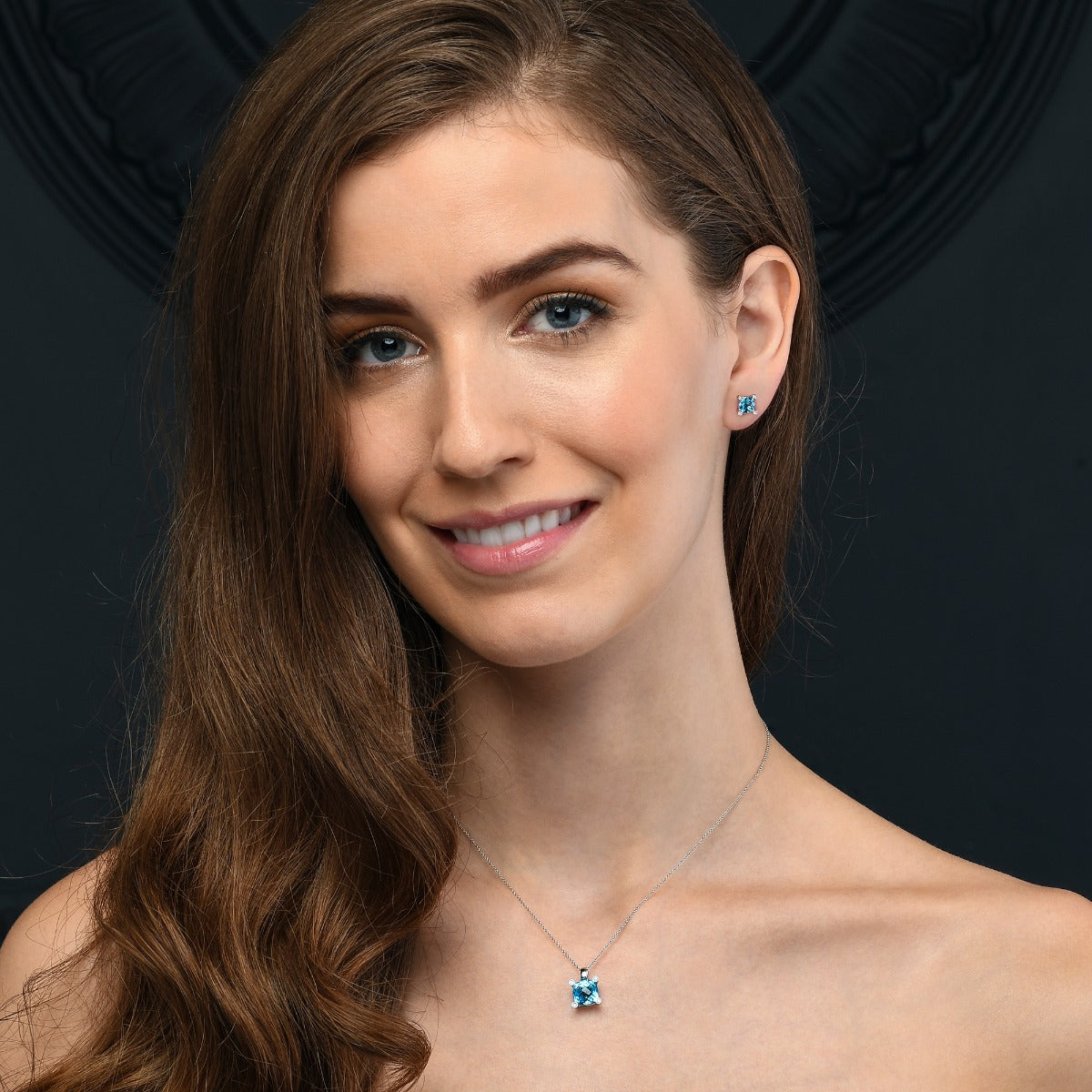 2.50ct Blue Topaz And 0.05ct Diamond Stud Earrings In 9K White Gold