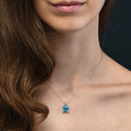 9mm x 9mm Cushion Blue Topaz with 0.03ct Diamond pendant in 9K white gold