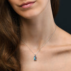 7mm x 12mm oval Blue Topaz with 0.03ct Diamond pendant necklace in 9K white gold