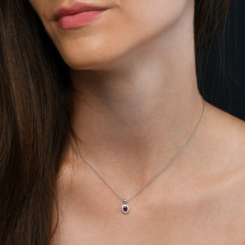3mm x 5mm Ruby and 0.05ct Diamond pendant in 18K white gold