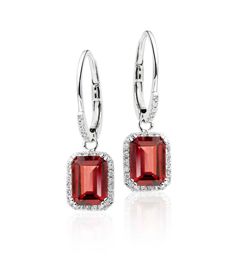 5mm x 7mm Garnet and 0.20ct diamond earrings in 9K white gold