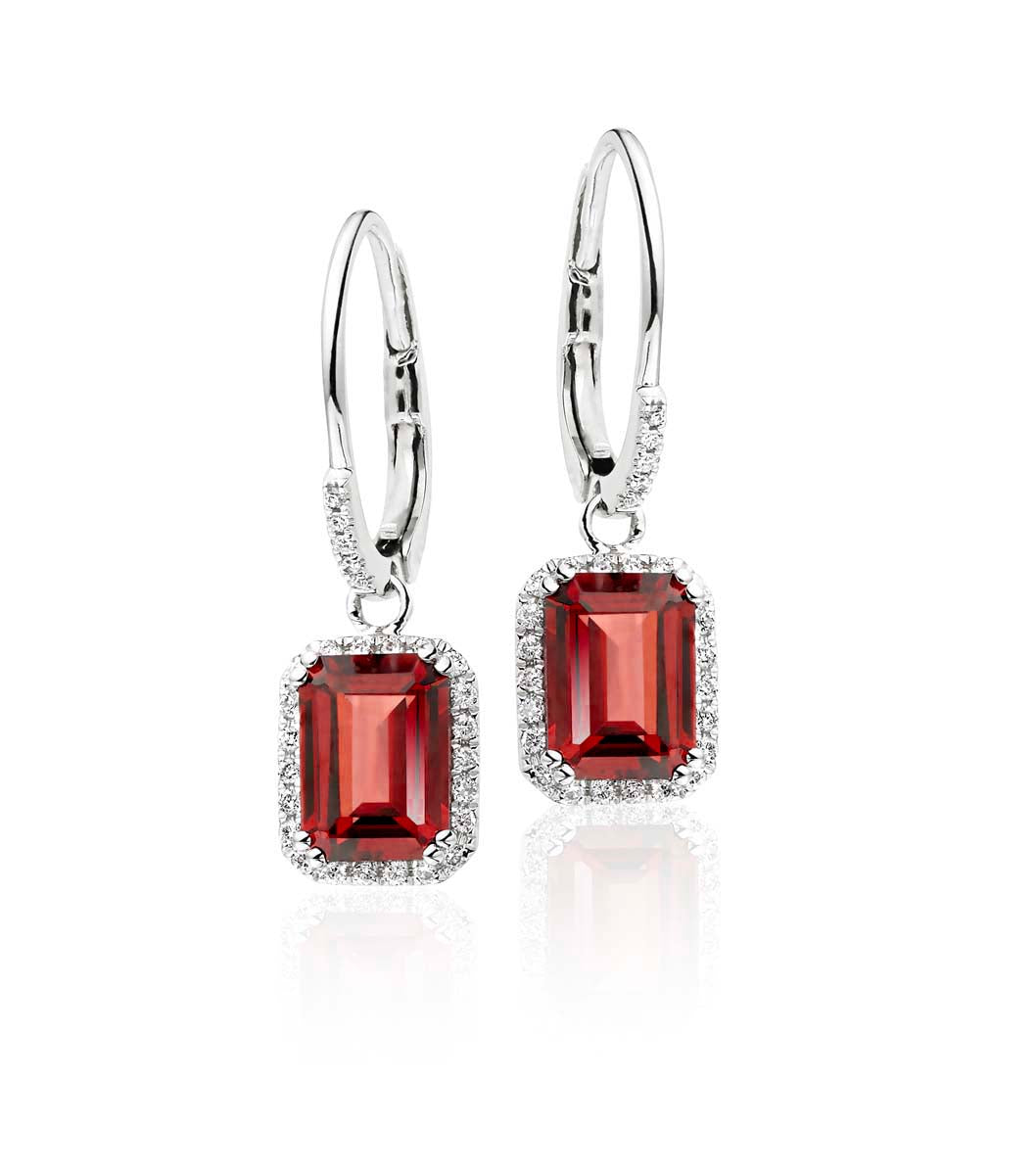 5mm x 7mm Garnet and 0.20ct diamond earrings in 9K white gold
