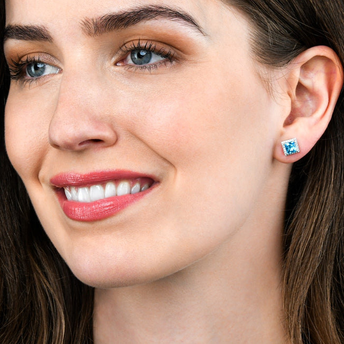 1.80ct Blue Topaz And 0.19ct Diamond Stud Earrings In 9K White Gold