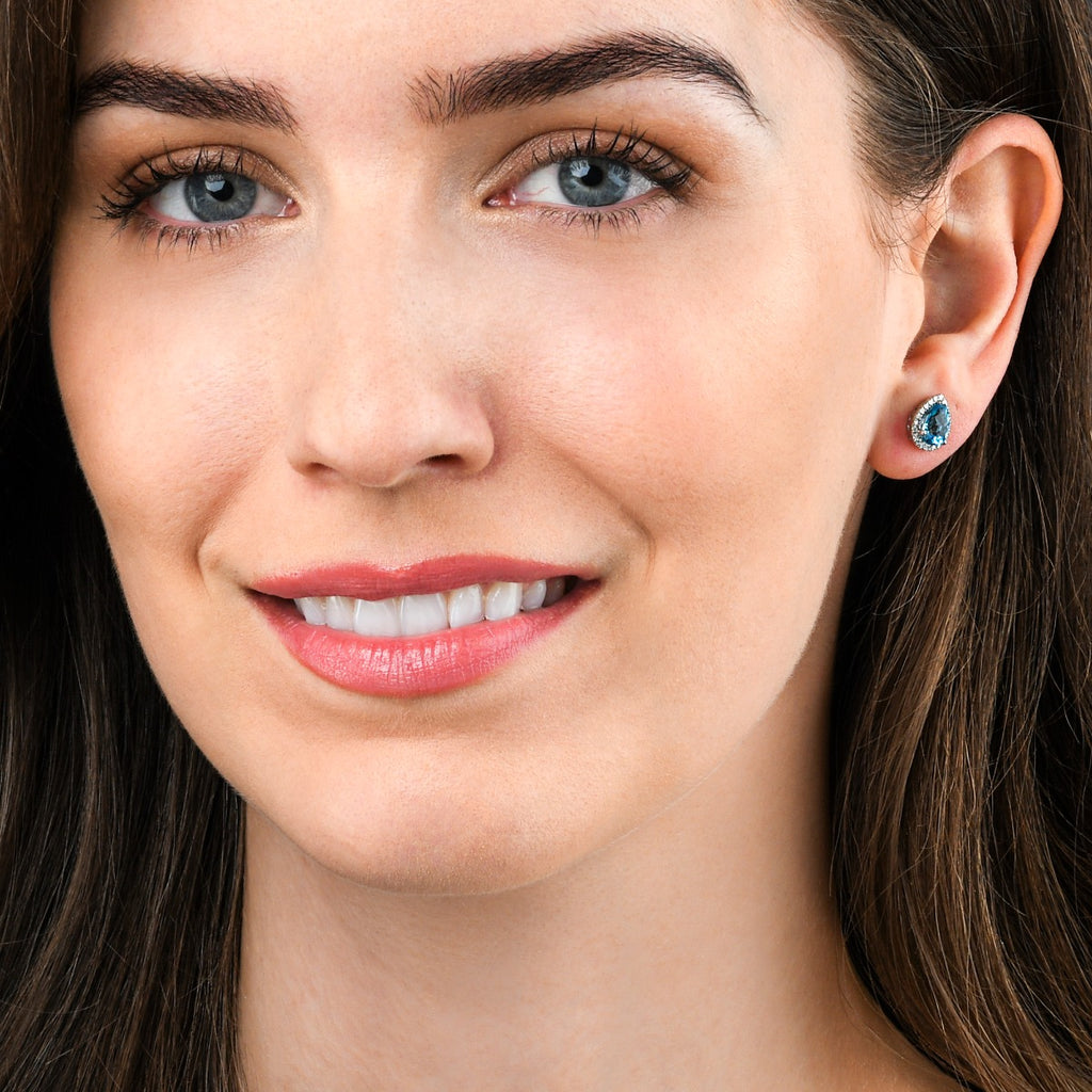 2.10ct Blue Topaz And 0.16ct Diamond Stud Earrings In 9K White Gold