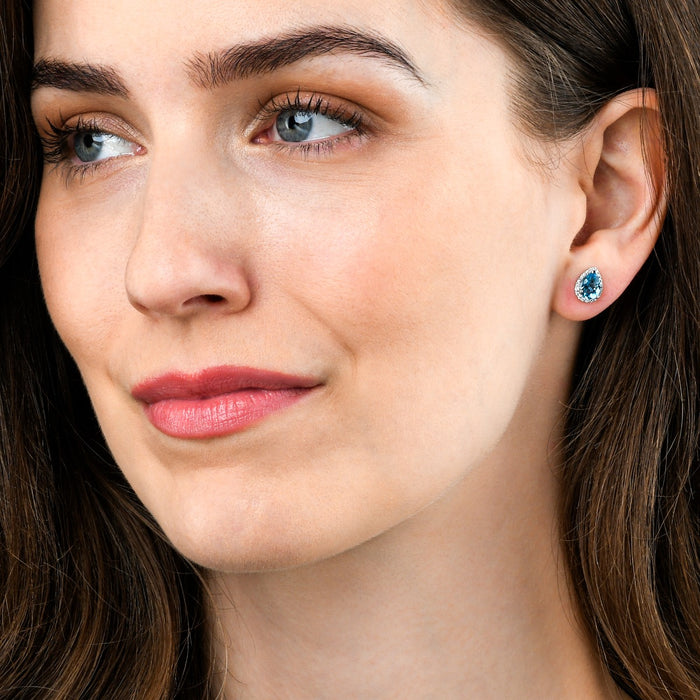 2.10ct Blue Topaz And 0.16ct Diamond Stud Earrings In 9K White Gold