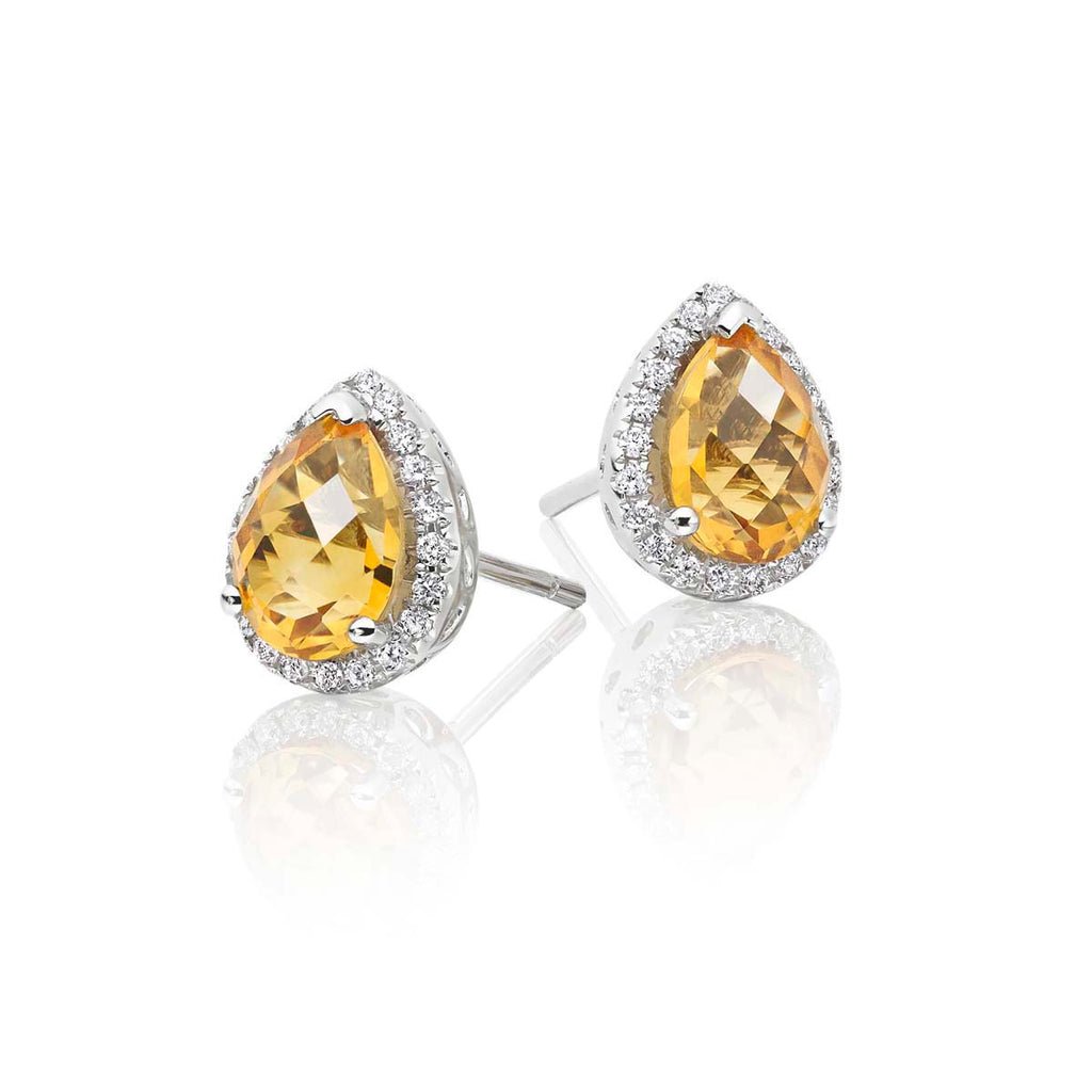 5mm x 7mm Citrine and 0.16ct diamond stud earrings in 9K white gold 