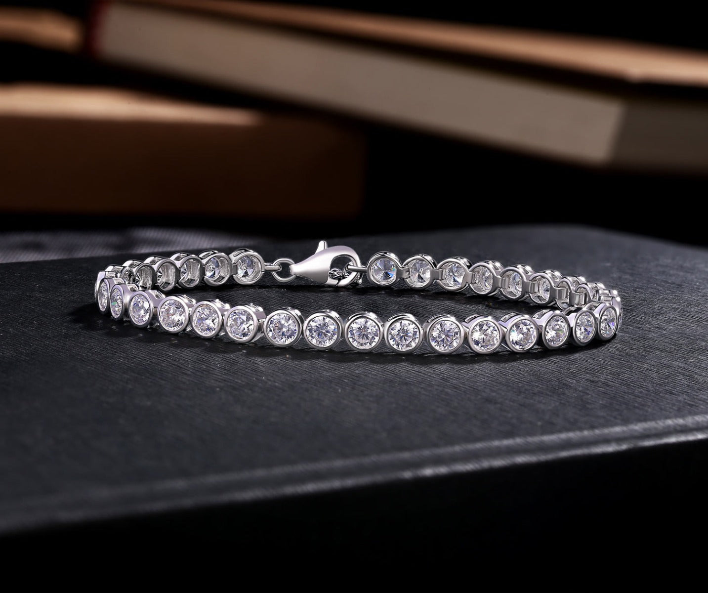Bezel Set Sterling Silver Tennis Bracelet 4mm White Cubic Zirconia on book