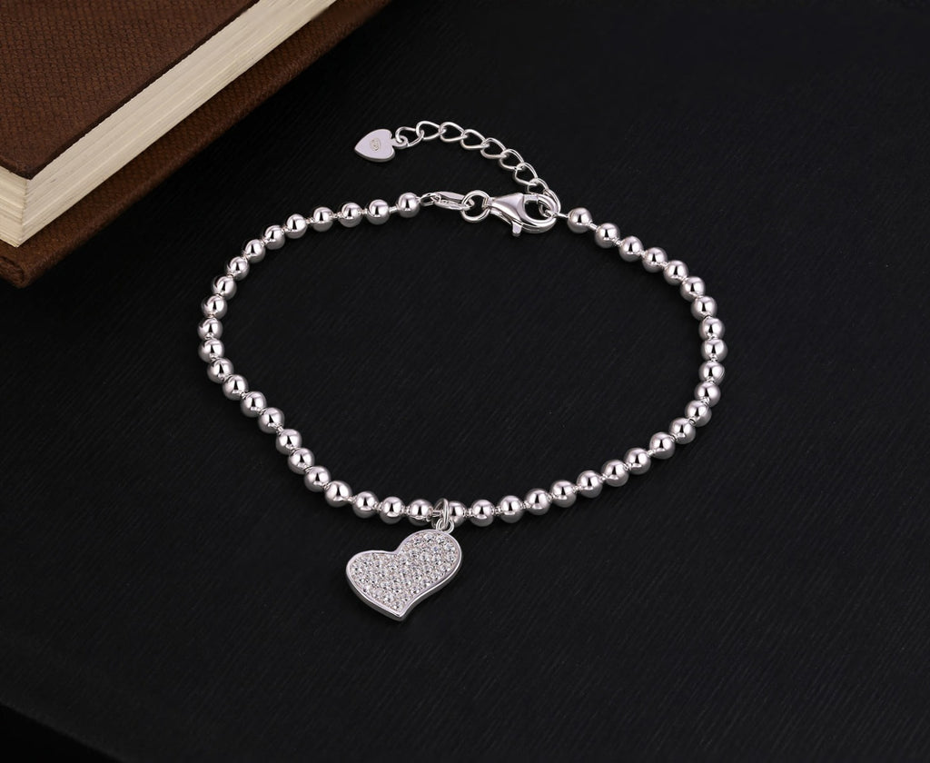 Sterling Silver Ball Bracelet Heart Shape Charm & White Cubic Zirconia near book