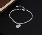 Sterling Silver Ball Bracelet Heart Shape Charm & White Cubic Zirconia near book