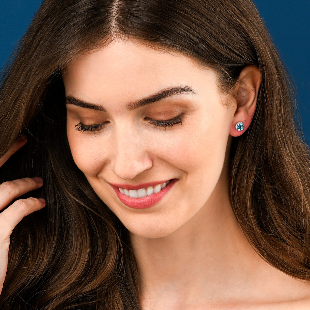 2.00ct Blue Topaz And 0.12ct Diamond Stud Earrings In 9K White Gold