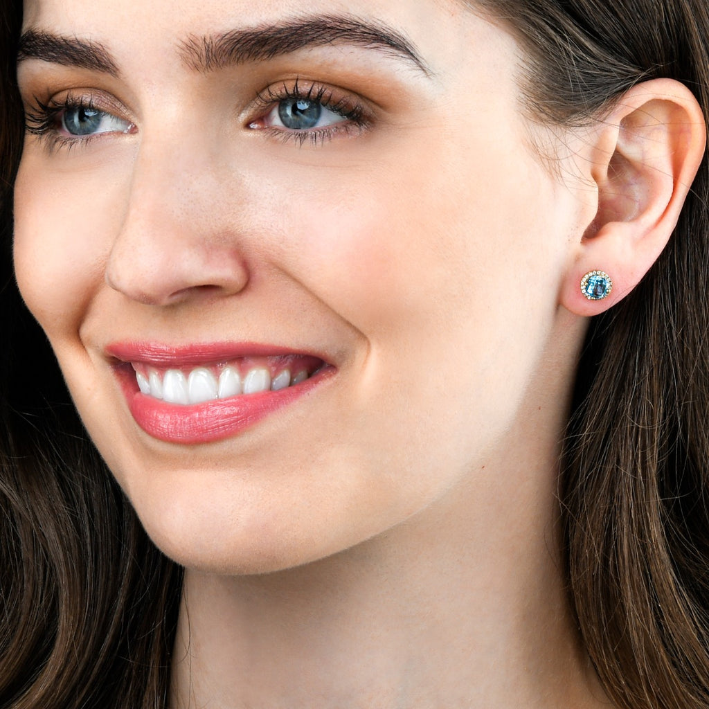 6mm Blue Topaz and 0.12ct diamond stud earrings in 18K yellow gold 