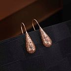 Side view of Rose Gold Plated Conical Web 925 Sterling Silver Drop Earrings