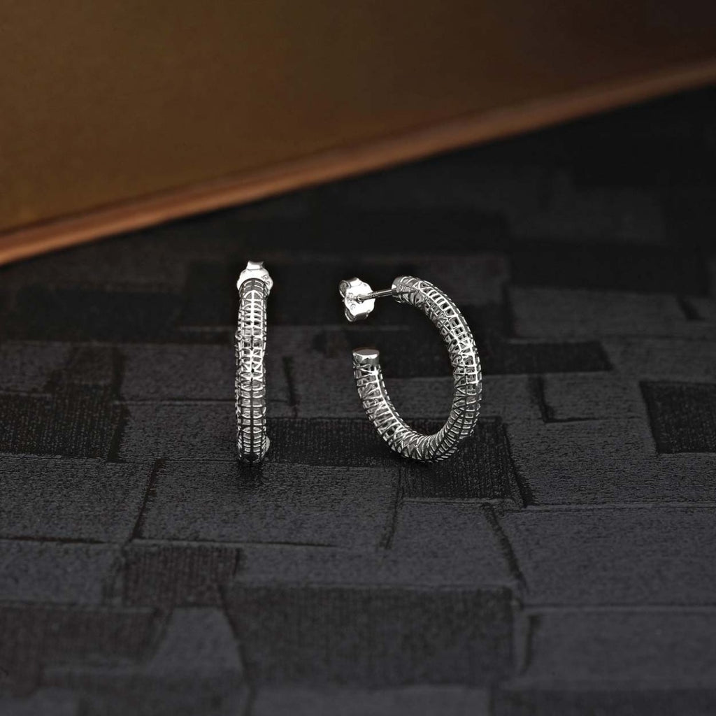 Web Design 925 Sterling Silver Hoop Earrings on black surface