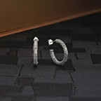 Web Design 925 Sterling Silver Hoop Earrings on black surface