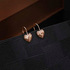 Rose Gold Plated Webbed Heart 925 Sterling Silver Drop Earrings on black surface