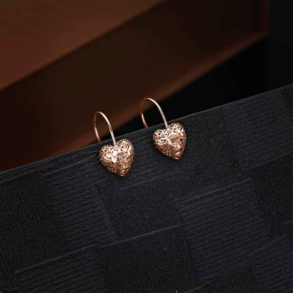 Rose Gold Plated Webbed Heart 925 Sterling Silver Drop Earrings on black surface