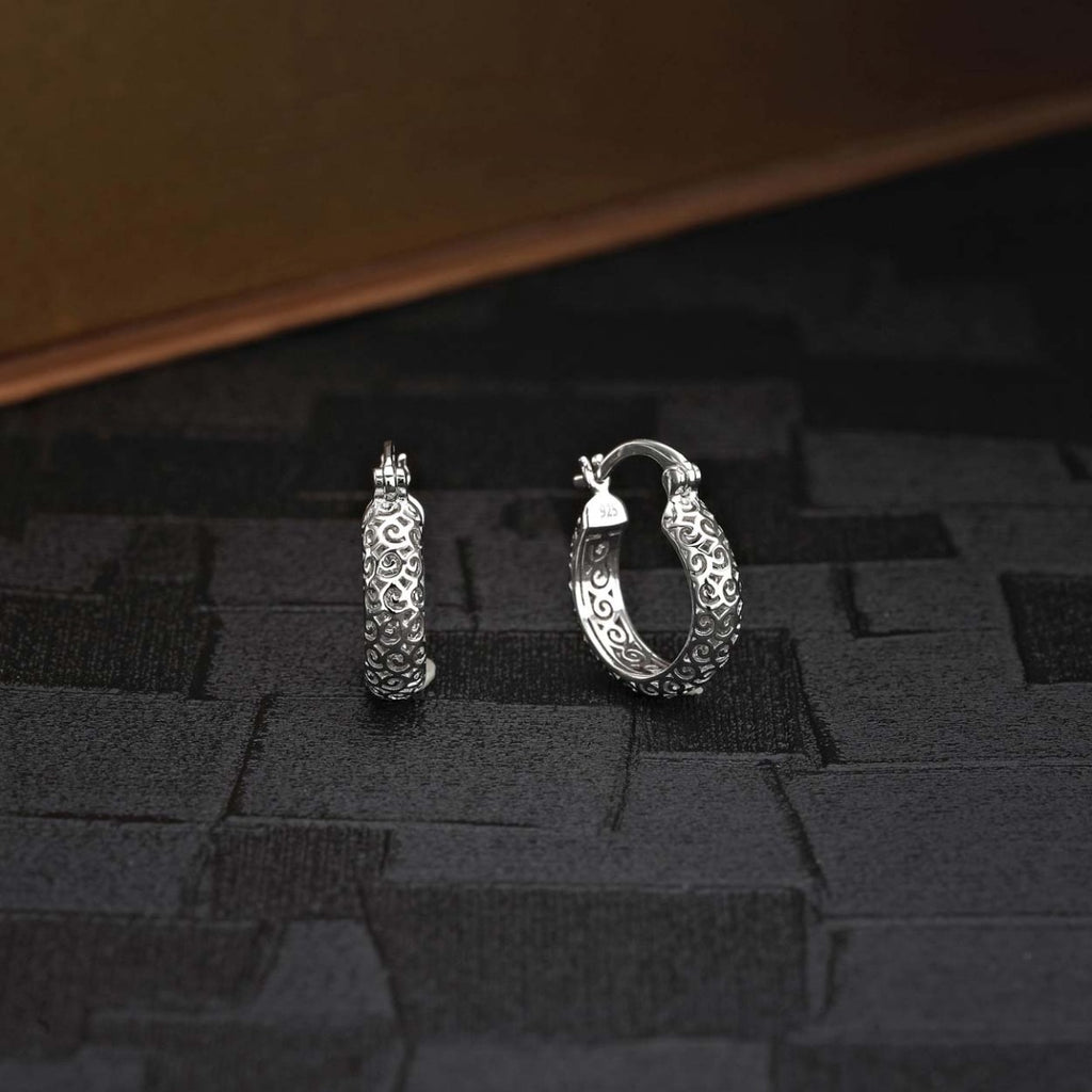 Ornate 925 Sterling Silver Hoop Earrings on black surface