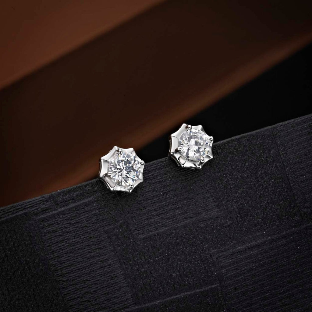 Sparkling Star 925 Sterling Silver Stud Earrings with Cubic Zirconia on black surface