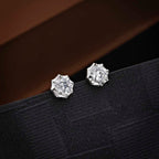 Sparkling Star 925 Sterling Silver Stud Earrings with Cubic Zirconia on black surface