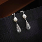 Vintage Conical Freshwater Pearl Earrings in 925 Sterling Silver on black surface