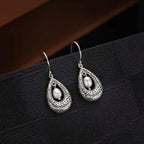Vintage Freshwater Pearl 925 Sterling Silver Dangling Earrings on black surface