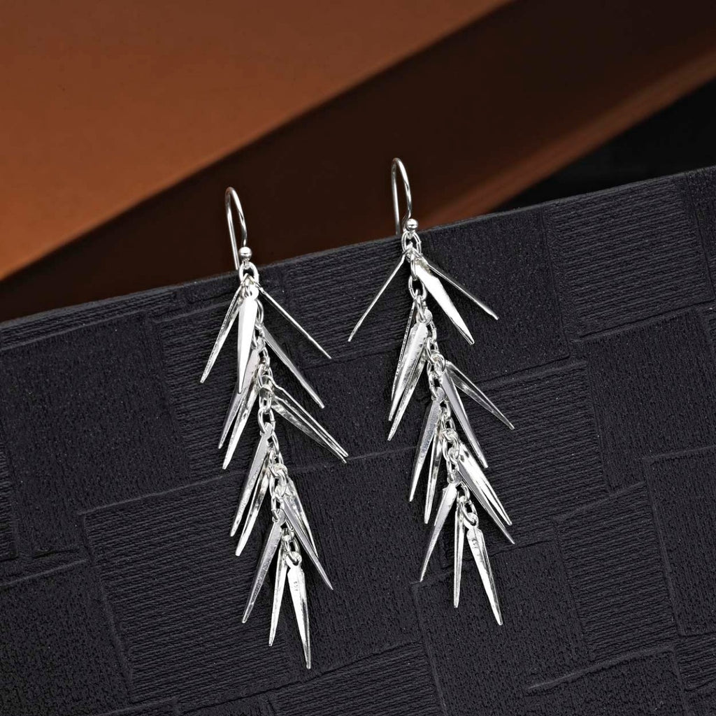 Pine Needle 925 Sterling Silver Drop Earrings on black surface