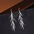 Pine Needle 925 Sterling Silver Drop Earrings on black surface