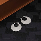 Milgrain Disk 925 Sterling Silver Hoop Earrings on black surface