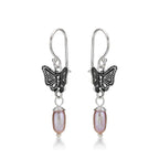 Side view of Pearl and Oxidised Butterfly Drop Earrings in 925 Sterling Silver