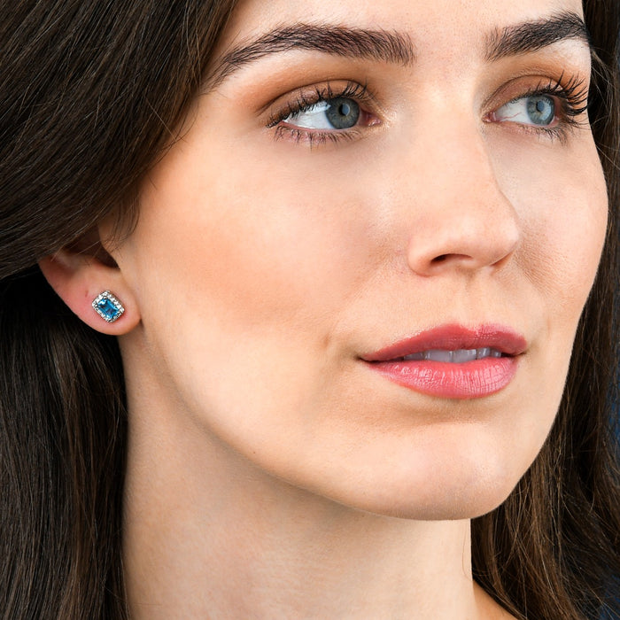 1.20ct Blue Topaz And 0.15ct Diamond Stud Earrings In 9K White Gold