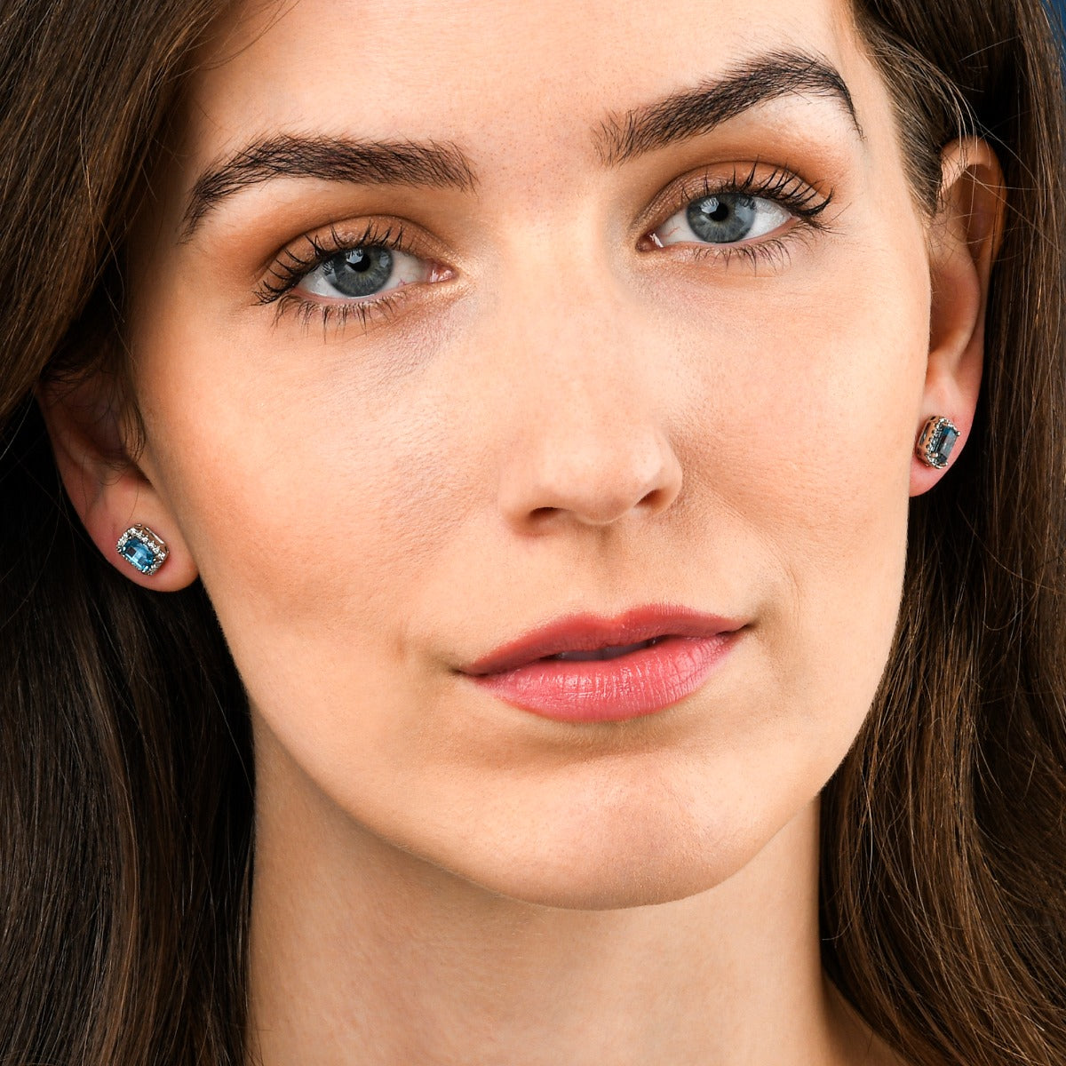 1.20ct Blue Topaz And 0.15ct Diamond Stud Earrings In 9K White Gold