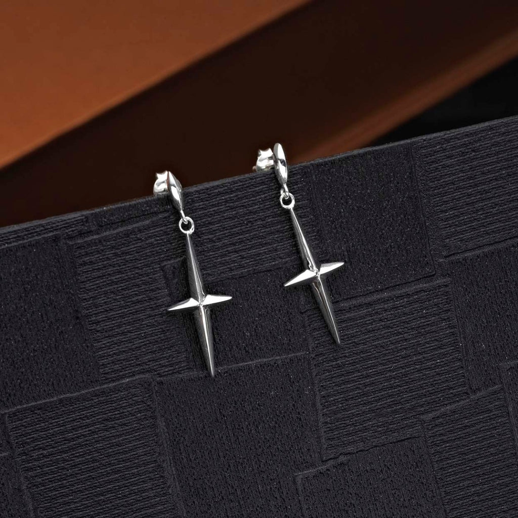 Simple Cross Drop Earrings in 925 Sterling Silver on black surface
