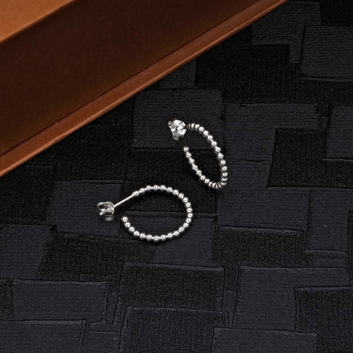 Beaded Design 925 Sterling Silver Hoop Earrings on black surface