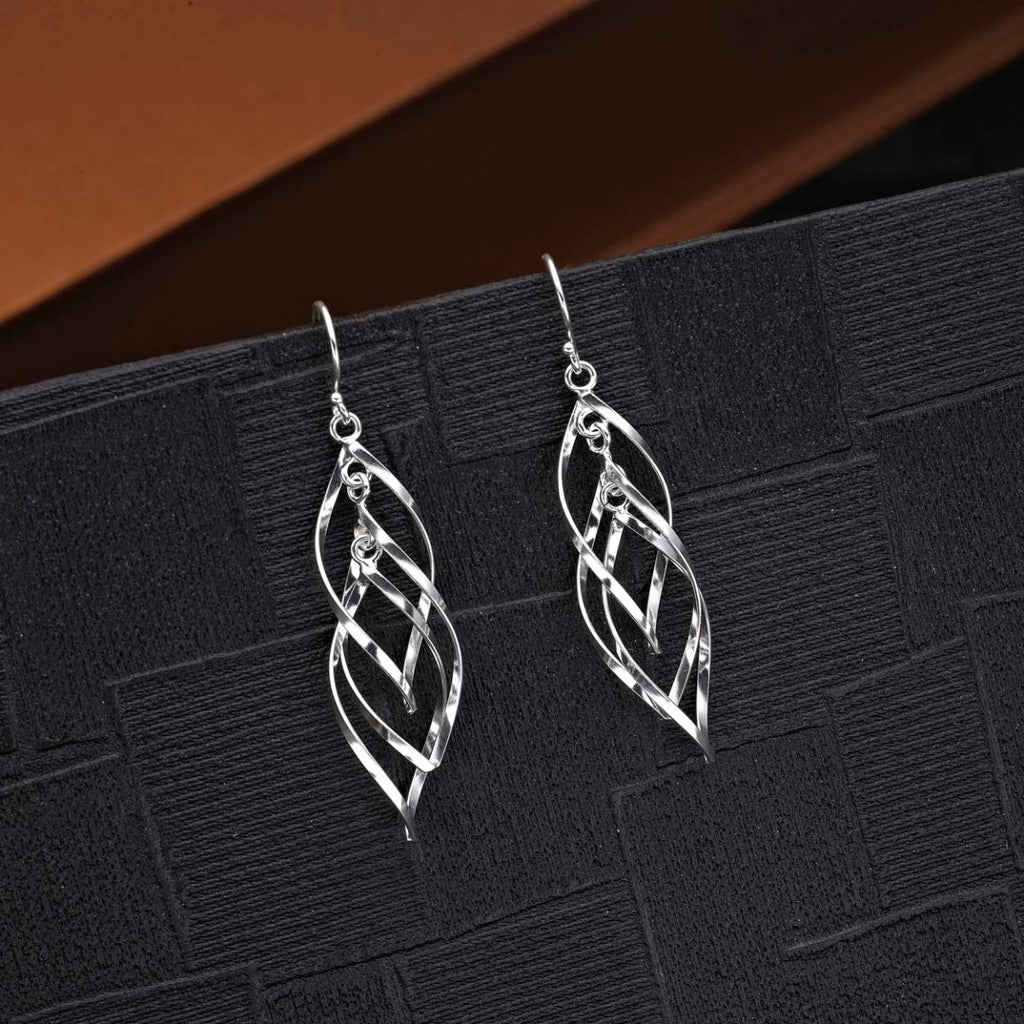 Dangling Spiral 925 Sterling Silver Twirl Earrings on black surface