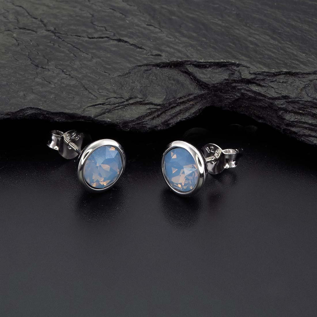 Air Blue Opal Swarovski Stud Earrings Sterling Silver on rock
