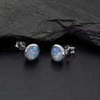 Air Blue Opal Swarovski Stud Earrings Sterling Silver on rock